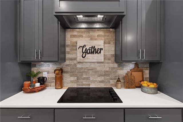 98 Bartram Trl, Brunswick, GA 31523 - kitchen with gray cabinets, black electric cooktop, decorative backsplash, and light countertops