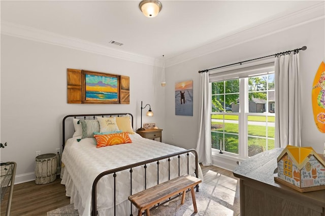 98 Bartram Trl, Brunswick, GA 31523 - bedroom with crown molding, wood finished floors, and baseboards