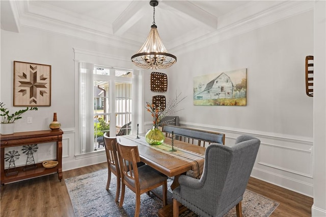98 Bartram Trl, Brunswick, GA 31523 - dining area with a chandelier, wood finished floors, beamed ceiling, crown molding, and a decorative wall