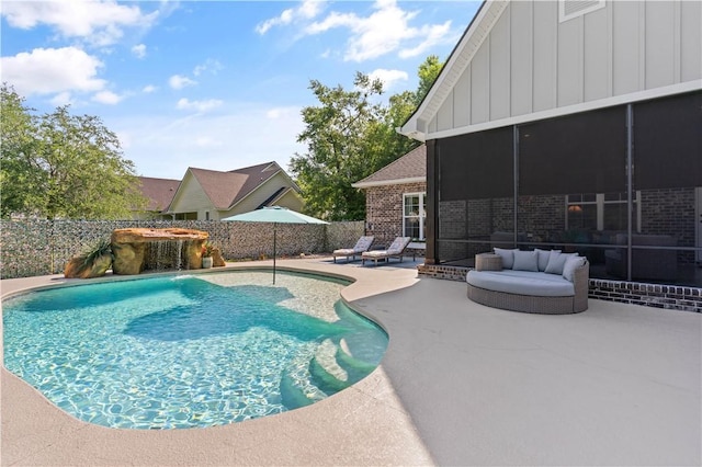 98 Bartram Trl, Brunswick, GA 31523 - view of pool with a patio, a sunroom, and a fenced backyard