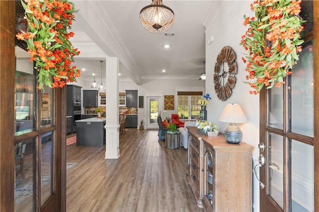 98 Bartram Trl, Brunswick, GA 31523 - entryway with crown molding, wood finished floors, recessed lighting, a chandelier, and a ceiling fan