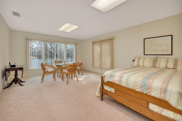 bedroom with visible vents and carpet flooring