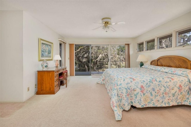 bedroom with carpet floors, access to outside, ceiling fan, and baseboards