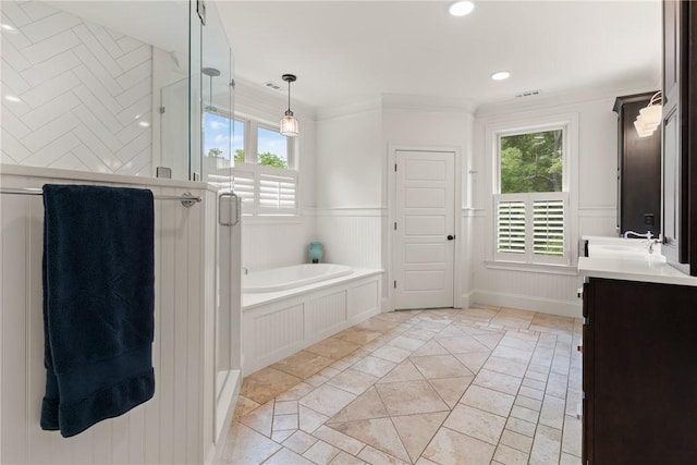 553 Park Ave, Saint Simons Island, GA 31522 - full bathroom featuring inlaid floor details, vanity, a garden tub, a stall shower, and recessed lighting