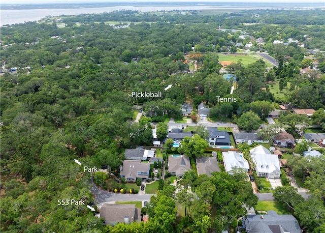553 Park Ave, Saint Simons Island, GA 31522 - aerial view of property and surrounding area with a large body of water, nearby suburban area, and a forest
