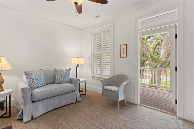 553 Park Ave, Saint Simons Island, GA 31522 - living area featuring ceiling fan, crown molding, healthy amount of natural light, carpet flooring, and baseboards