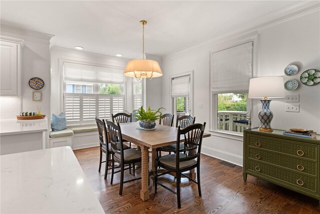 553 Park Ave, Saint Simons Island, GA 31522 - dining space with ornamental molding, dark wood-style flooring, recessed lighting, and baseboards