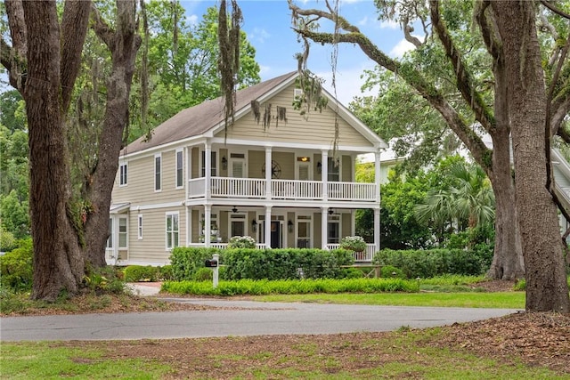 553 Park Ave, Saint Simons Island, GA 31522 - back of house with a porch, a ceiling fan, and a balcony