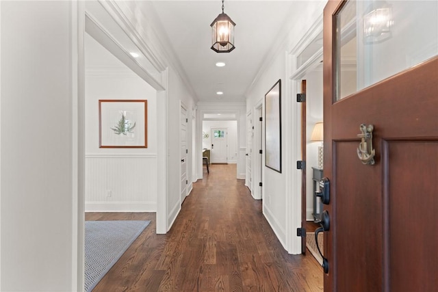 553 Park Ave, Saint Simons Island, GA 31522 - corridor with dark wood finished floors, crown molding, baseboards, and recessed lighting