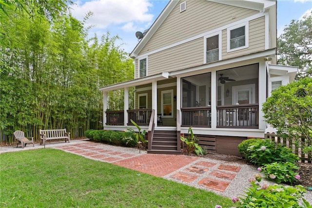 553 Park Ave, Saint Simons Island, GA 31522 - view of front of house with a front yard and a patio