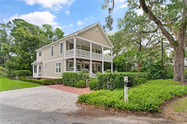 553 Park Ave, Saint Simons Island, GA 31522 - view of front of home with ceiling fan, covered porch, and a balcony