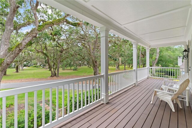 553 Park Ave, Saint Simons Island, GA 31522 - porch featuring a yard and view of scattered trees