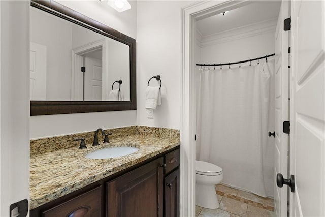 553 Park Ave, Saint Simons Island, GA 31522 - bathroom with ornamental molding, vanity, toilet, curtained shower, and stone finish floors