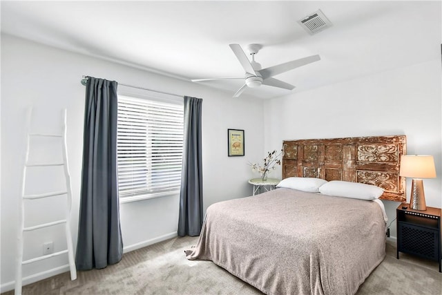 bedroom featuring ceiling fan and light carpet