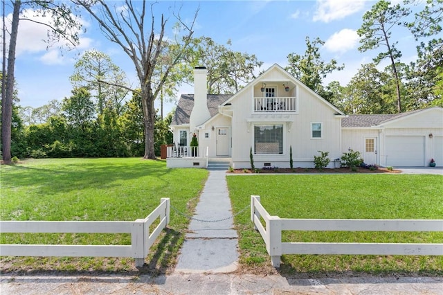 686 S Fourth St, Jesup, GA 31545 - view of front of home featuring a balcony, a fenced front yard, a chimney, crawl space, and a garage