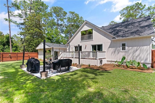 686 S Fourth St, Jesup, GA 31545 - rear view of house featuring a patio area and a shingled roof