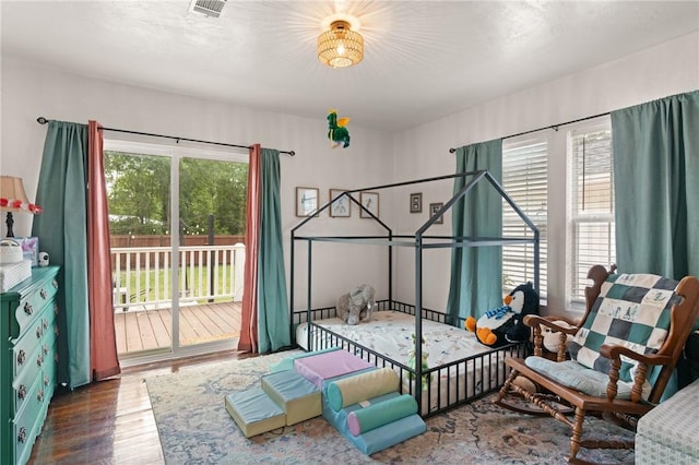 686 S Fourth St, Jesup, GA 31545 - bedroom with access to outside and wood finished floors