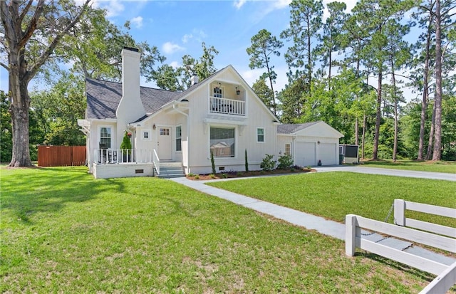 686 S Fourth St, Jesup, GA 31545 - view of front of house featuring concrete driveway, board and batten siding, a garage, a chimney, and crawl space
