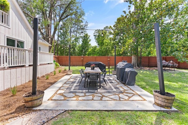686 S Fourth St, Jesup, GA 31545 - fenced backyard with a patio and outdoor dining space
