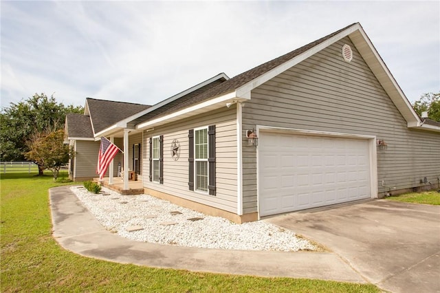 4901 Stanfield Rd, Patterson, GA 31557 - view of side of home with driveway, a garage, and roof with shingles