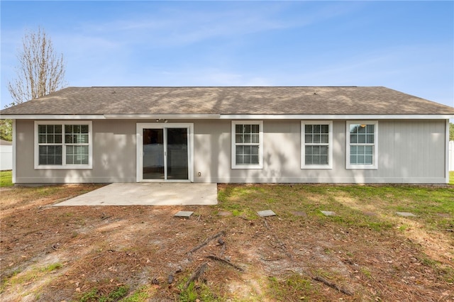 back of house featuring a patio and a yard