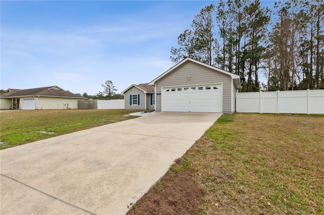 ranch-style home with a garage and a front lawn