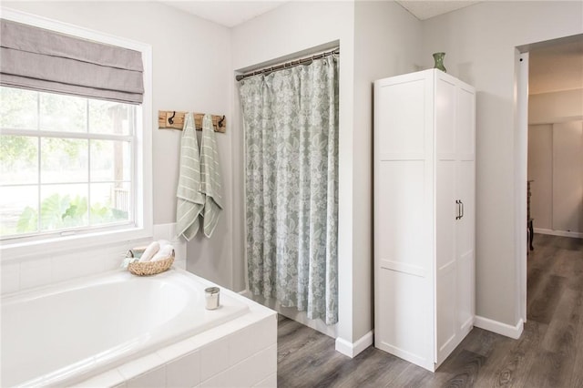 313 White Pine Highway, Nicholls, GA 31554 - bathroom with a bath, wood finished floors, and baseboards