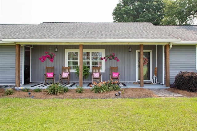 313 White Pine Highway, Nicholls, GA 31554 - doorway to property with a porch, a yard, and roof with shingles