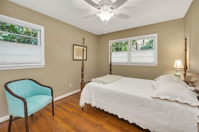 bedroom with wood-type flooring and ceiling fan