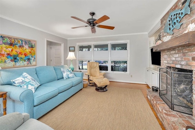 living room featuring ceiling fan, a fireplace, light hardwood / wood-style floors, and ornamental molding