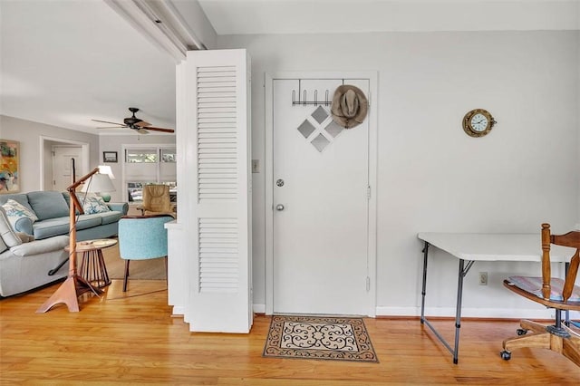 foyer featuring hardwood / wood-style floors and ceiling fan