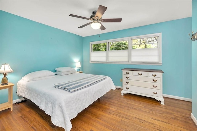 bedroom featuring hardwood / wood-style flooring and ceiling fan