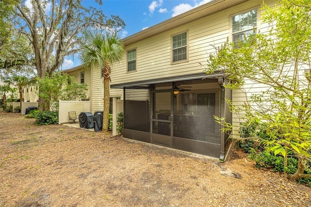 back of property featuring a sunroom