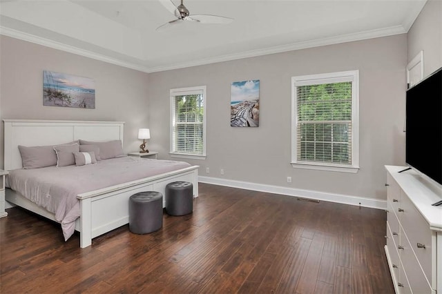 bedroom featuring dark wood-style flooring, crown molding, baseboards, and ceiling fan