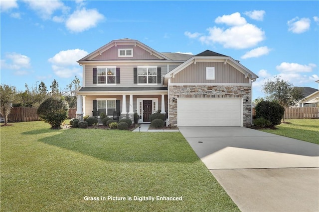 craftsman house with a garage, covered porch, and a front yard