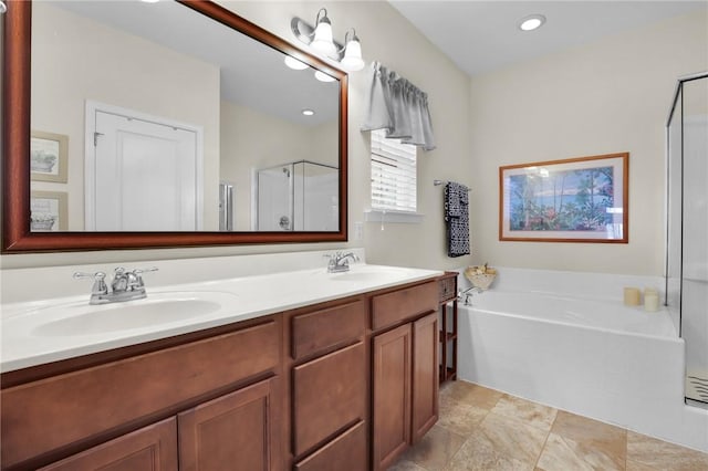 bathroom featuring separate shower and tub and vanity