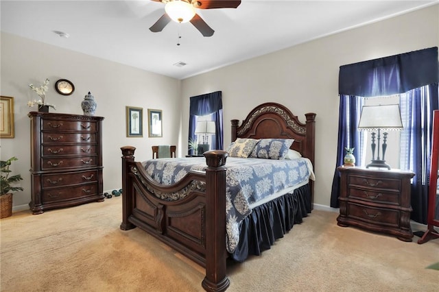 bedroom featuring ceiling fan and light colored carpet