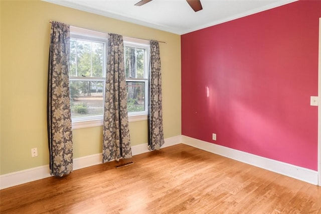 empty room featuring hardwood / wood-style flooring and ceiling fan