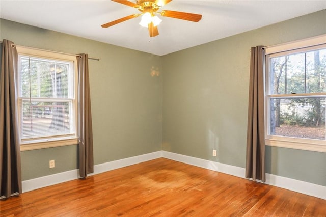 unfurnished room featuring hardwood / wood-style flooring and ceiling fan