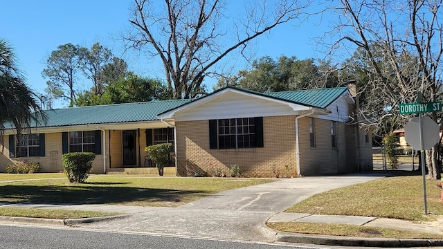 ranch-style house featuring a front yard and a carport