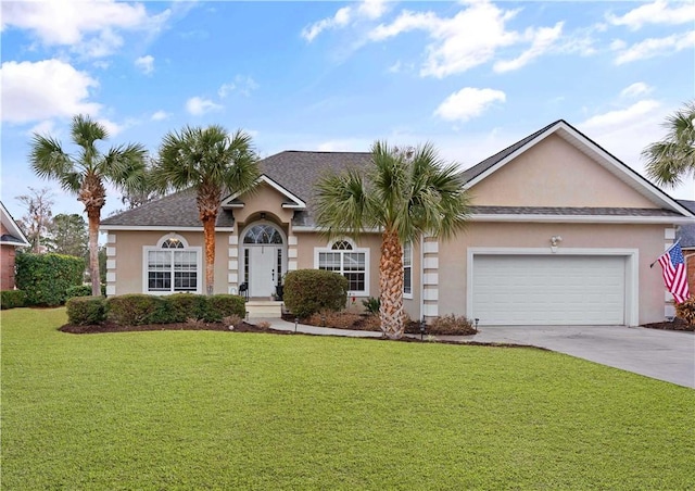 single story home with a garage and a front lawn