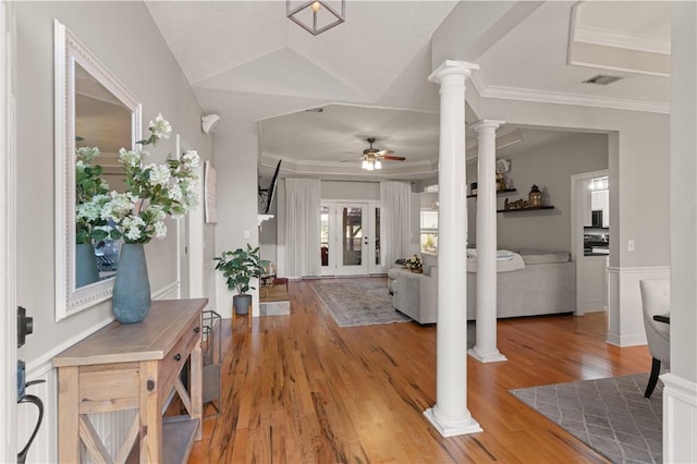 foyer with hardwood / wood-style flooring, ornamental molding, decorative columns, and ceiling fan