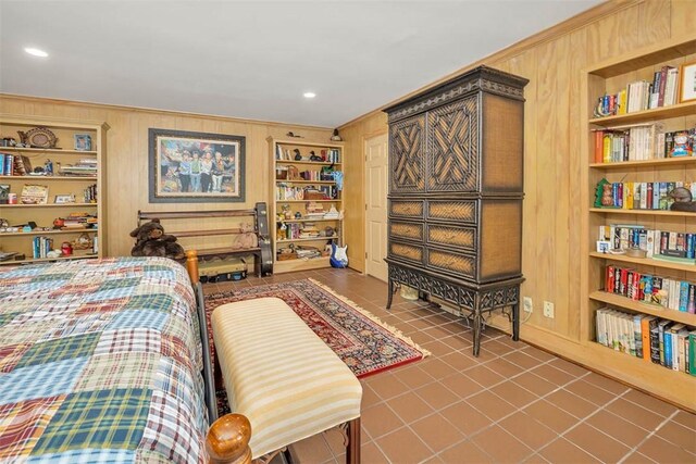 tiled bedroom featuring wooden walls