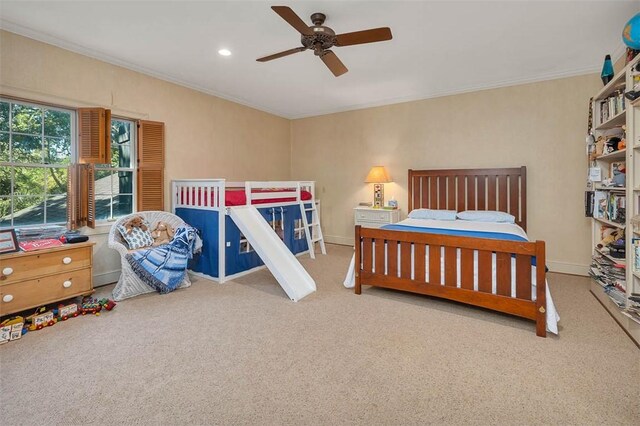 bedroom featuring carpet floors, ceiling fan, and ornamental molding