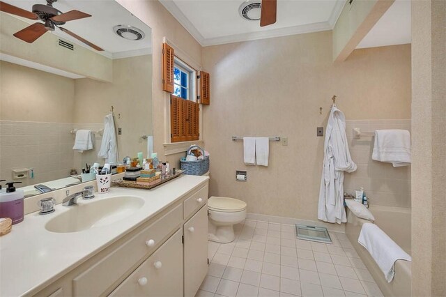 bathroom featuring tile patterned floors, ornamental molding, vanity, ceiling fan, and toilet