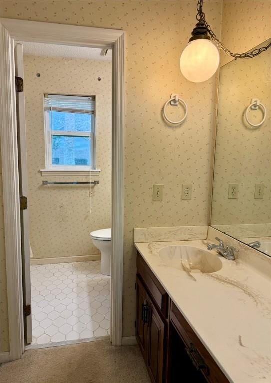 bathroom with vanity and toilet