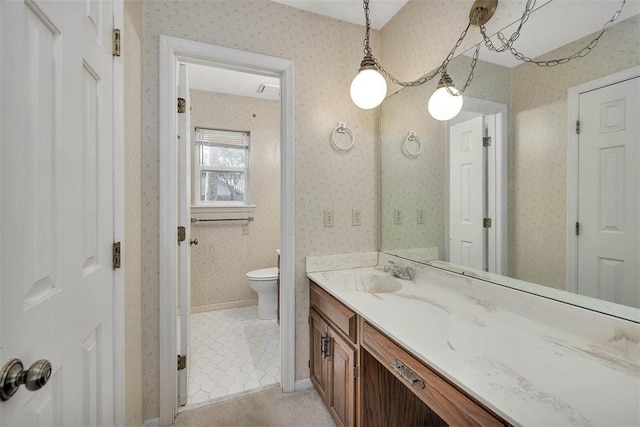 bathroom with vanity and toilet