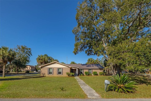 single story home with a front yard