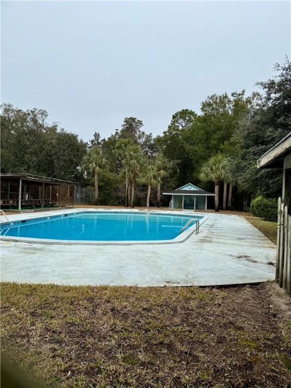 view of swimming pool with a patio area