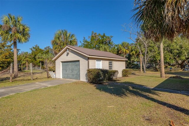 garage featuring a yard